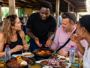Kofi Culture food tour guests trying traditional Ghanaian food in Accra